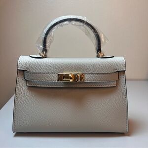 Genuine Epsom Leather mini handbag with shoulder strap featuring Gold hardware